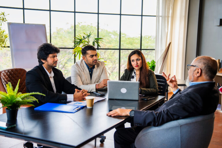 Indian business professionals in a strategic branding discussion during a corporate meeting
