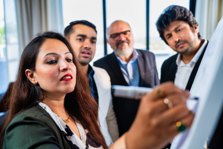 Indian business team collaborating on marketing strategy during a planning session